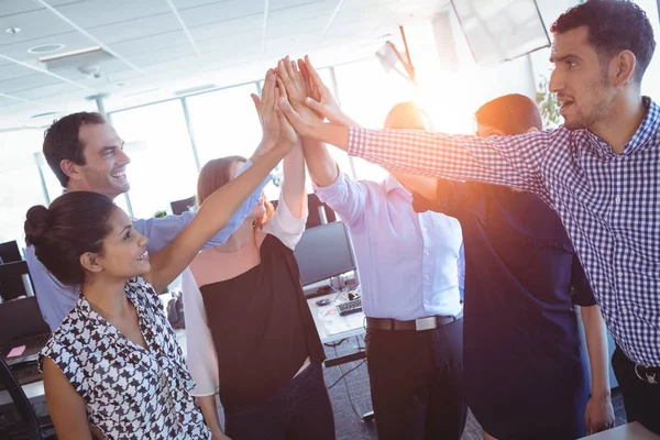 Business colleagues putting hands together — Stock Photo, Image