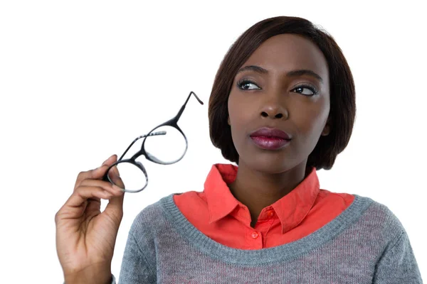 Woman holding eyeglasses — Stock Photo, Image