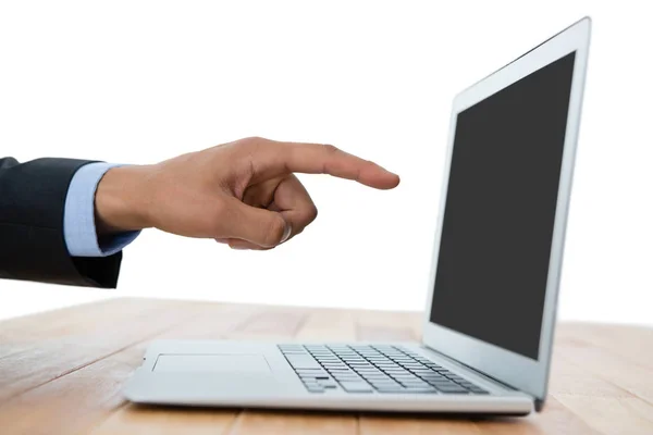 Businessman pointing on laptop — Stock Photo, Image