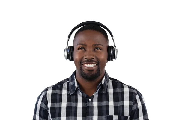 Man listening to music on headphones — Stock Photo, Image