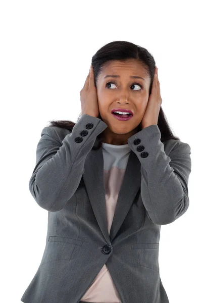 Businesswoman covering ears with hands — Stock Photo, Image