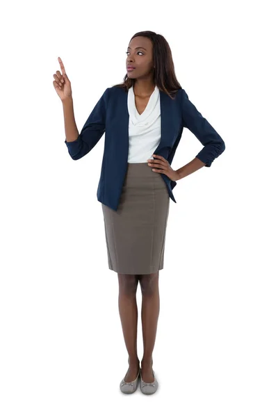 Businesswoman giving presentation with hand on hip — Stock Photo, Image