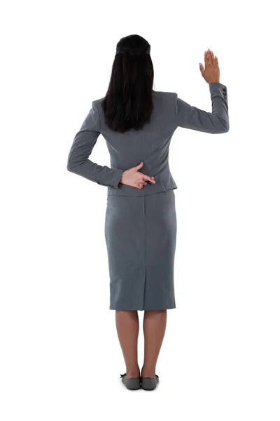 Businesswoman raising her hand — Stock Photo, Image