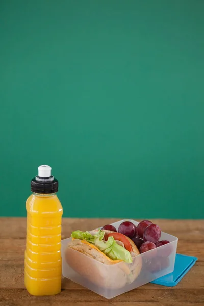 Tiffin box with fruit and sandwich — Stock Photo, Image