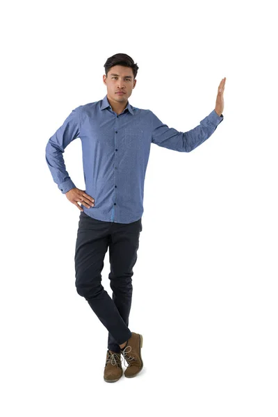 Businessman standing with hand on hip — Stock Photo, Image