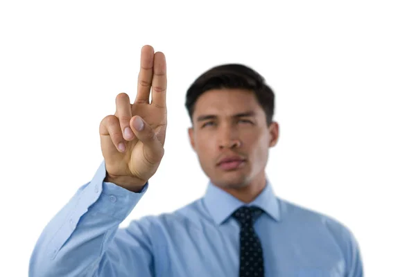 Businessman touching invisible screen — Stock Photo, Image