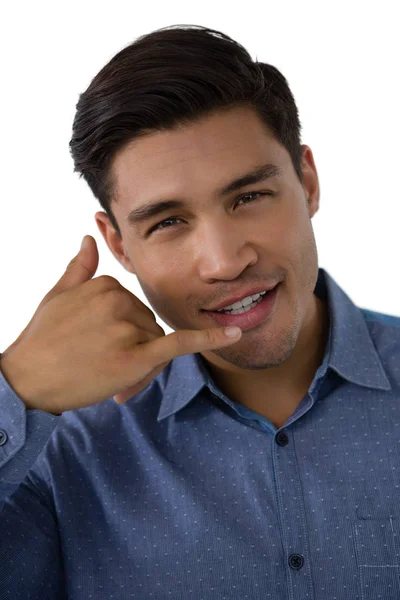 Businessman gesturing call hand sign — Stock Photo, Image