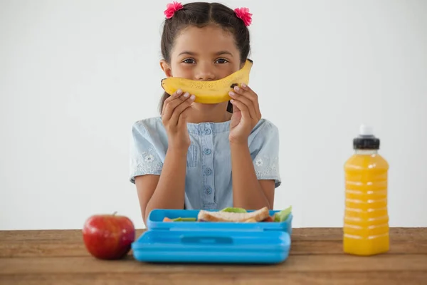 Schoolgirl having breakfast — Stock Photo, Image