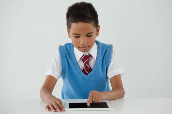 Schoolboy using digital tablet — Stock Photo, Image