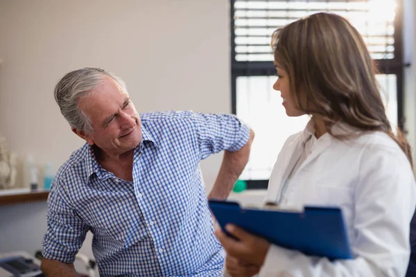 Patient showing back ache to doctor — Stock Photo, Image