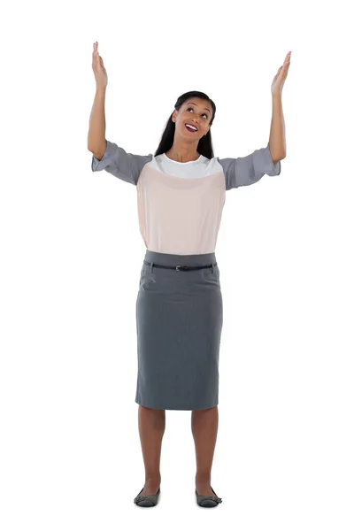 Businesswoman standing with hands raised — Stock Photo, Image