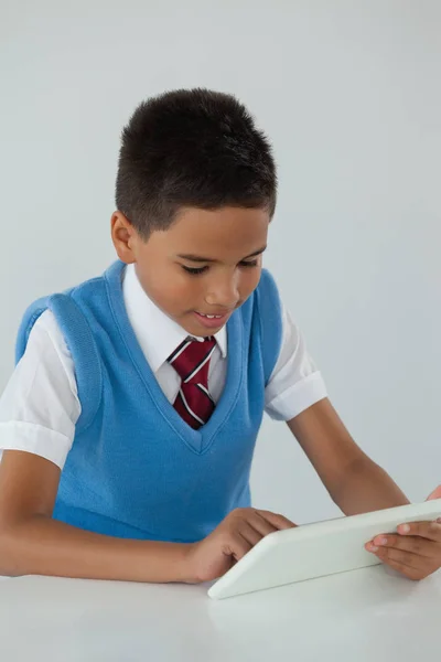 Schoolboy using digital tablet — Stock Photo, Image