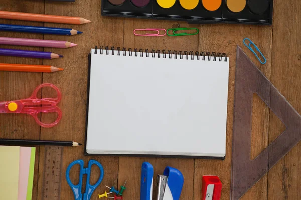 Notebook with Various school supplies — Stock Photo, Image