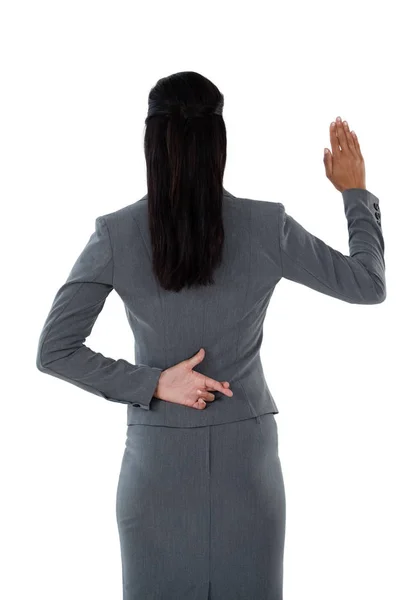 Businesswoman raising hand — Stock Photo, Image