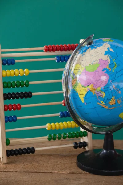 Globe and colorful abacus — Stock Photo, Image