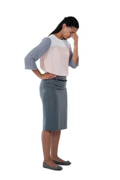 Stressed businesswoman standing with head down — Stock Photo, Image