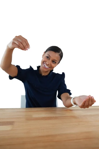 Businesswoman pretending to work on invisible object — Stock Photo, Image