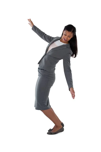 Businesswoman balancing while walking — Stock Photo, Image