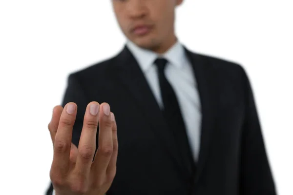 Businessman holding invisible thing — Stock Photo, Image