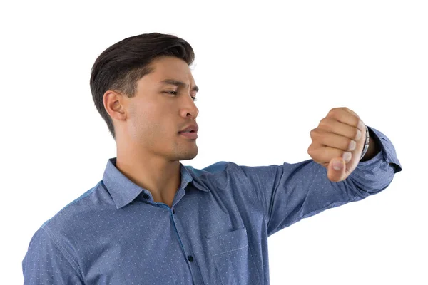 Businessman looking at wristwatch — Stock Photo, Image