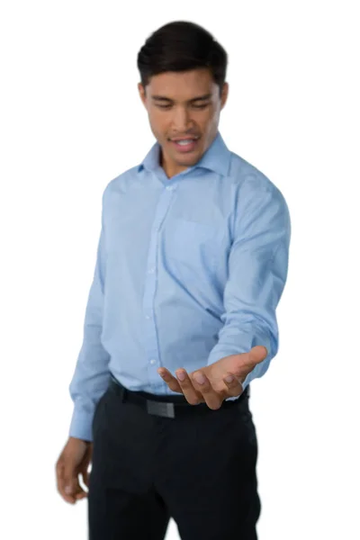 Businessman holding invisible thing — Stock Photo, Image