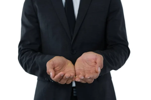 Businessman standing with hands cupped — Stock Photo, Image