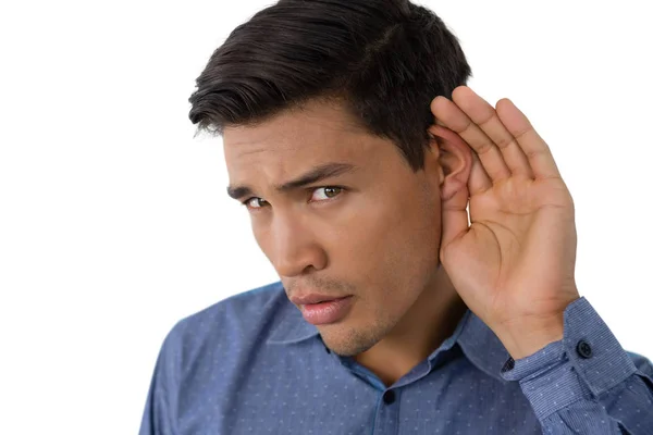 Uomo d'affari cupping orecchie — Foto Stock