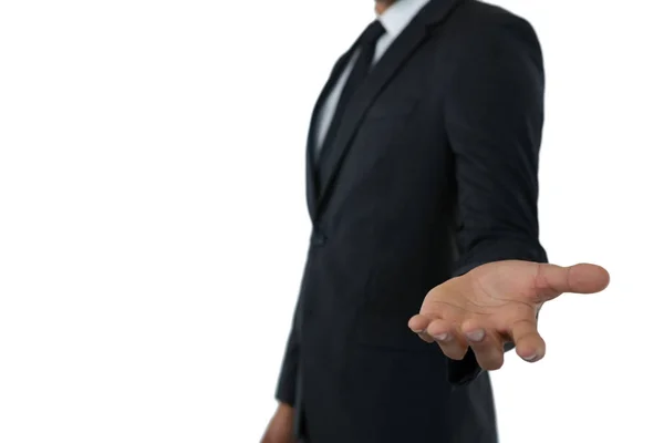 Businessman extending arm — Stock Photo, Image