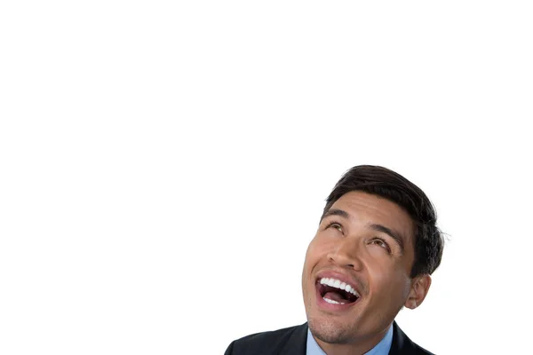 Happy businessman looking up — Stock Photo, Image
