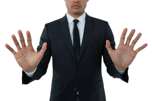 Businessman touching invisible interface — Stock Photo, Image