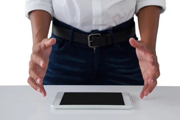 Teenage boy trying to hold tablet — Stock Photo, Image