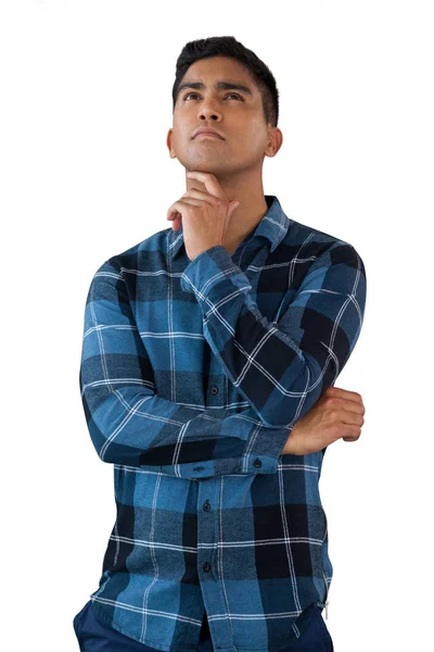 Thoughtful young man with hand on chin — Stock Photo, Image