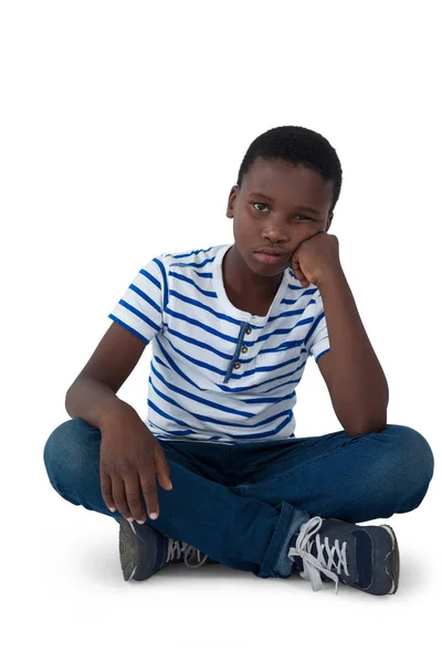 Sad boy sitting on floor — Stock Photo, Image