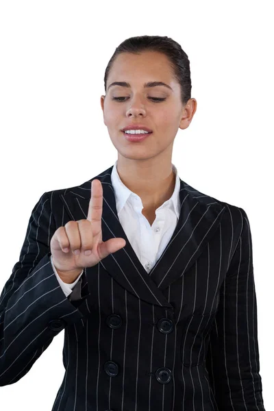 Businesswoman in suit touching invisible interface — Stock Photo, Image