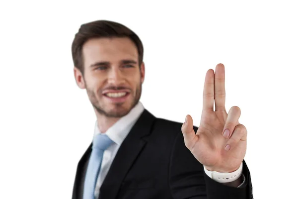 Businessman touching invisible screen — Stock Photo, Image