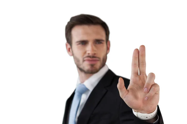 Confident businessman touching interface — Stock Photo, Image