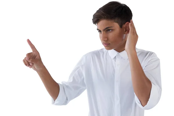 Boy pressing an invisible virtual screen — Stock Photo, Image