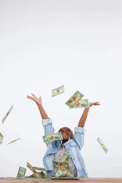 Businesswoman throwing paper currency in mid-air — Stock Photo, Image