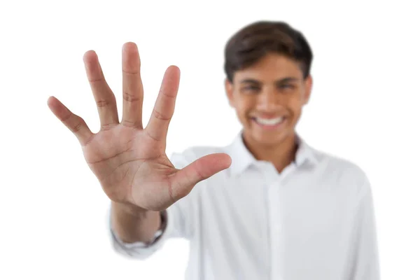 Teenage boy showing stop sign — Stock Photo, Image