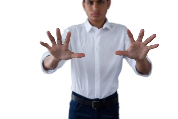 Teenage boy pressing an invisible virtual screen — Stock Photo, Image