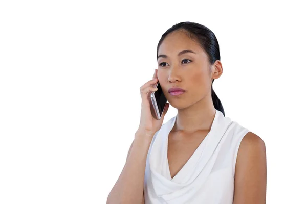 Serious businesswoman talking on mobile phone — Stock Photo, Image