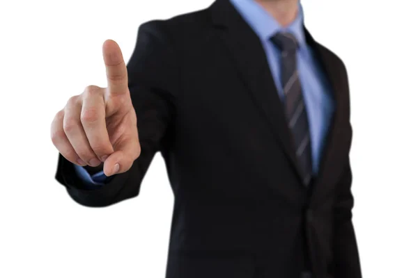 Businessman touching index finger on invisible screen — Stock Photo, Image