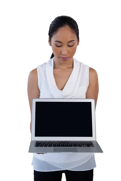 Businesswoman holding laptop computer — Stock Photo, Image