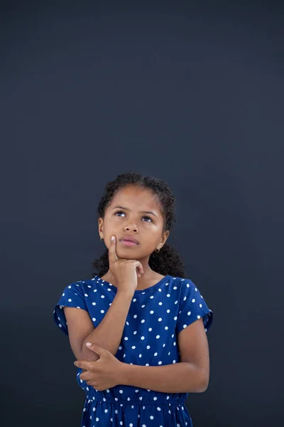 Contemplated girl with hand on chin — Stock Photo, Image