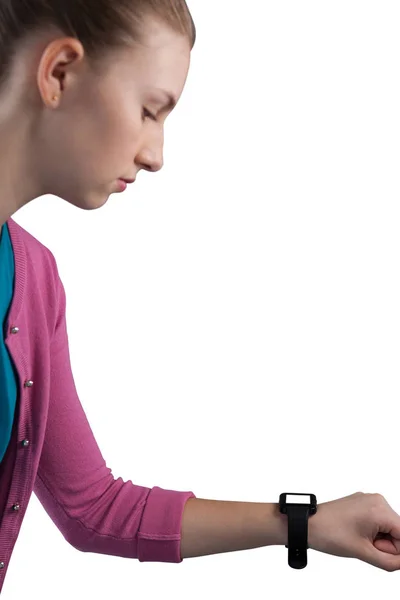 Teenage girl looking her smartwatch — Stock Photo, Image