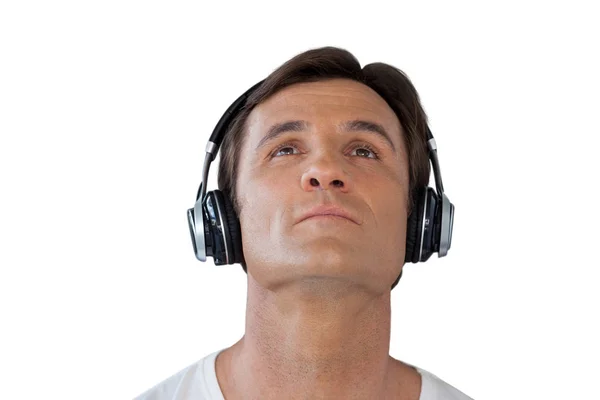 Thoughtful mature man wearing headphones — Stock Photo, Image