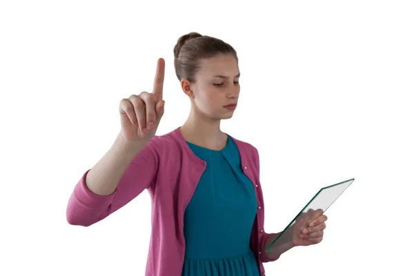 Teenage girl using a glass tablet Stock Picture