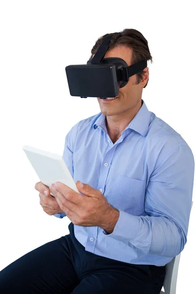 Businessman with tablet using vr glasses — Stock Photo, Image