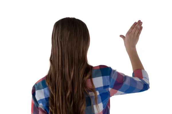 Girl pressing an invisible virtual screen — Stock Photo, Image