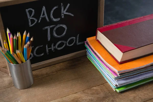 Text written on slate with school supplies — Stock Photo, Image